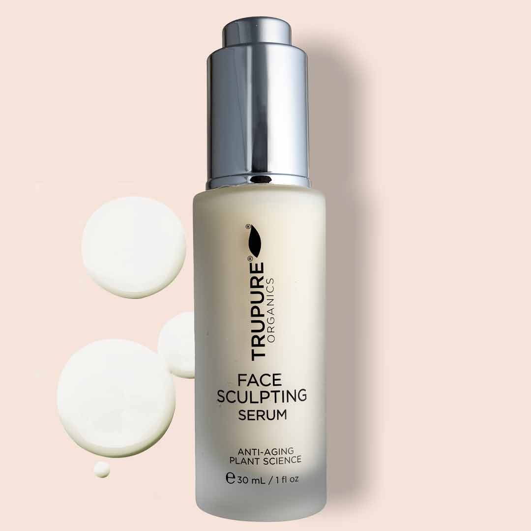 Face Sculpting Serum bottle on a pastel background